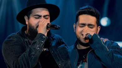 Henrique e Juliano realizam sonho de fã e emocionam em show