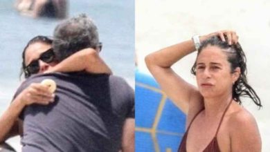 Andréa Beltrão é flagrada tomando banho de mar em dia quente no Rio na companhia do maridão