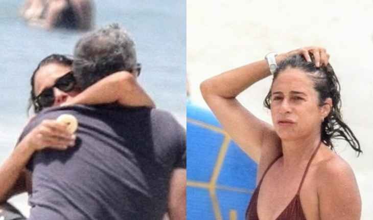 Andréa Beltrão é flagrada tomando banho de mar em dia quente no Rio na companhia do maridão